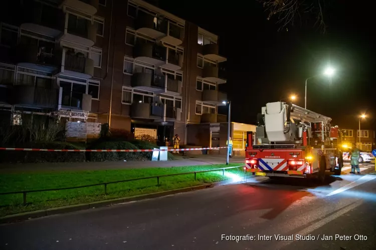 Brand in portiek, brandstichting mogelijke oorzaak